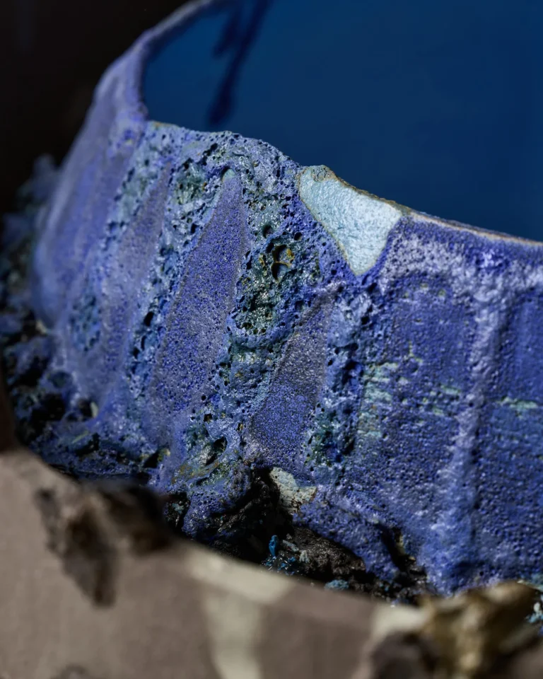 Close-up of the New_love_08 Ceramic Vase's porous, bubbled blue glaze on the inner bowl wall