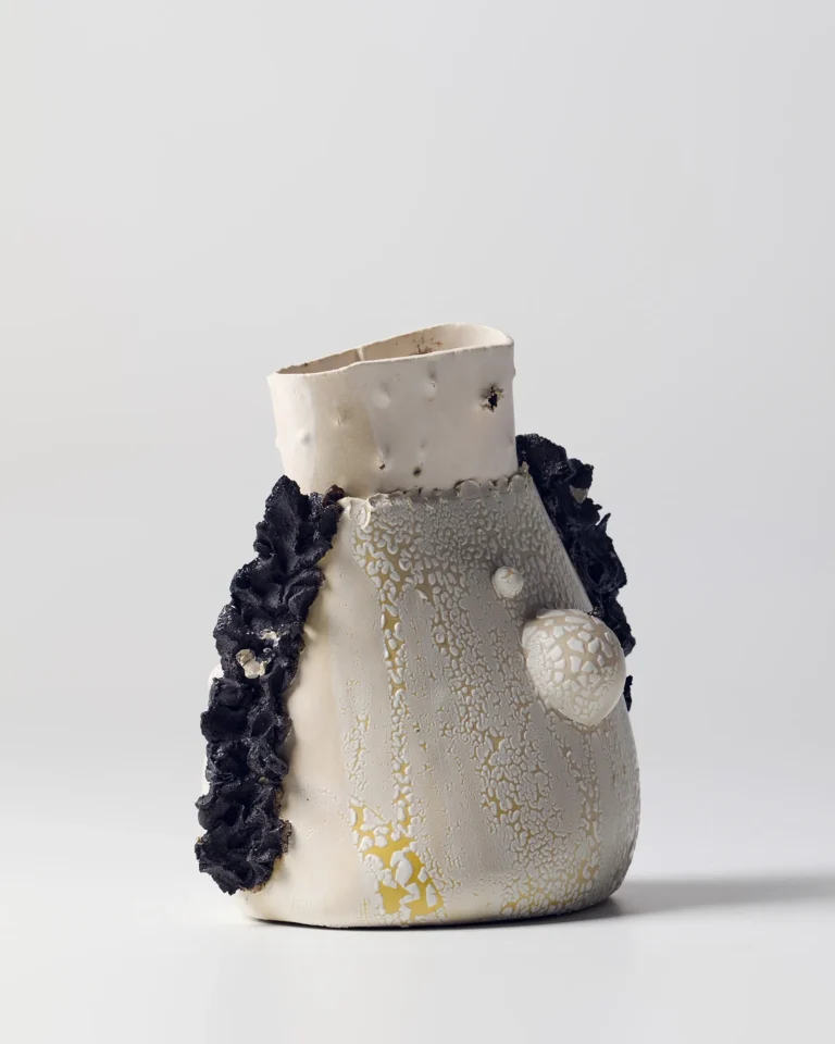 New_love_01 Ceramic Vase by C E R A M I C 4 7 seen at a three-quarter angle, showing the open rim and rounded knob